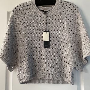 Women gray top with modern look